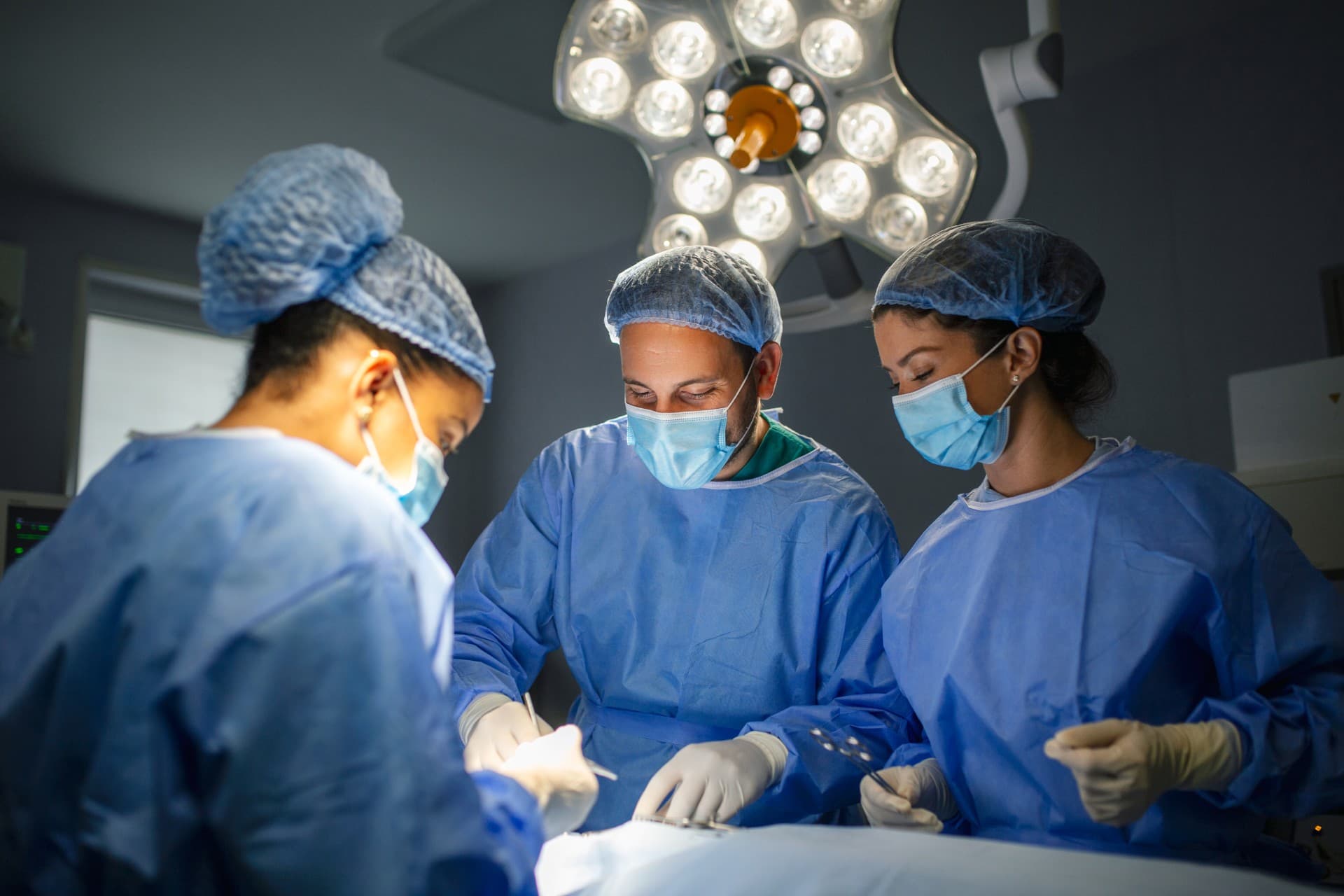 Surgical team performing shoulder procedure