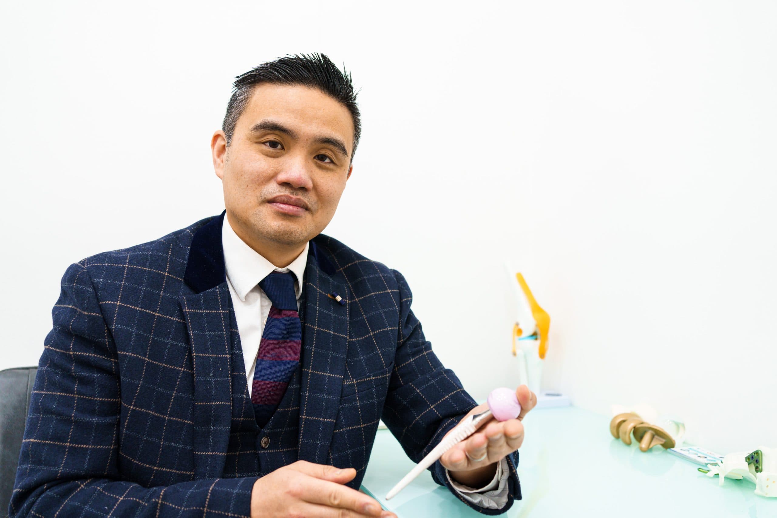 Professor Paul Lee with an anatomical joint model at London Cartilage Clinic